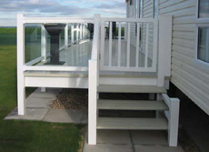 Steps and Gates to a glass sided verandah